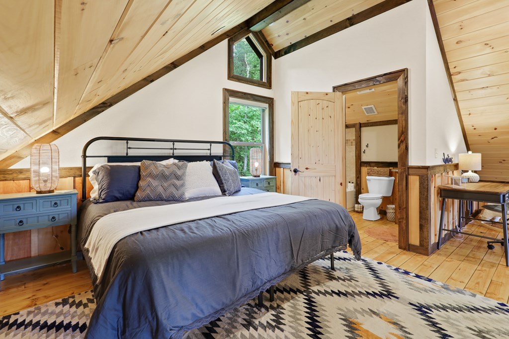 42 Old Jerusalem Road Morganton, GA 30560 - Photo 31 of 61 a bed sitting in a bedroom next to a window