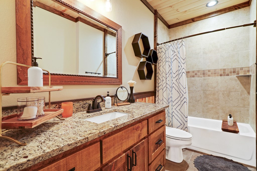 42 Old Jerusalem Road Morganton, GA 30560 - Photo 40 of 61 a bathroom with a granite countertop sink and a mirror