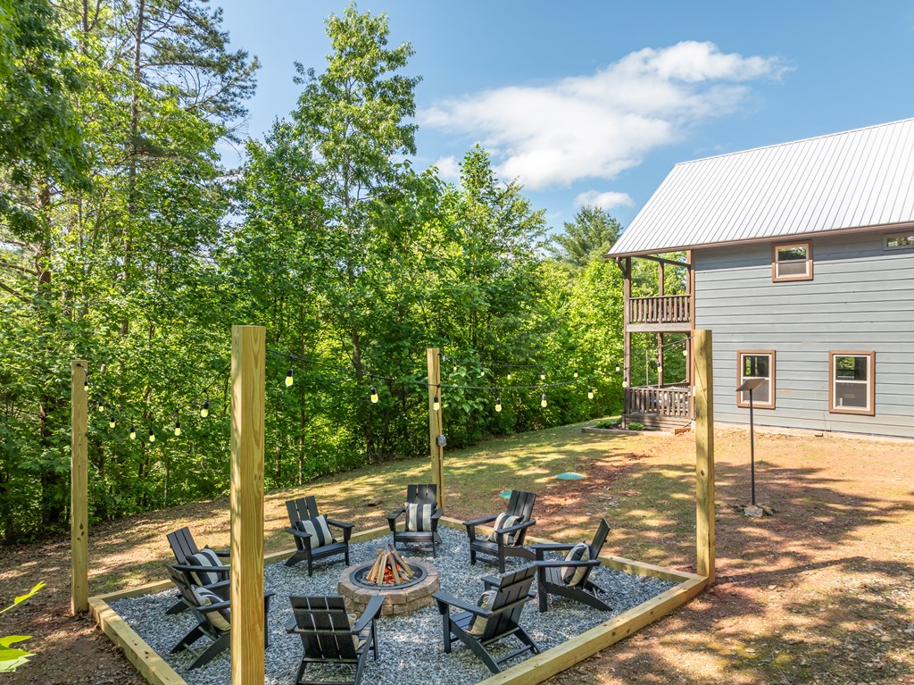 42 Old Jerusalem Road Morganton, GA 30560 - Photo 55 of 61 a view of a patio with table and chairs and floor to ceiling window