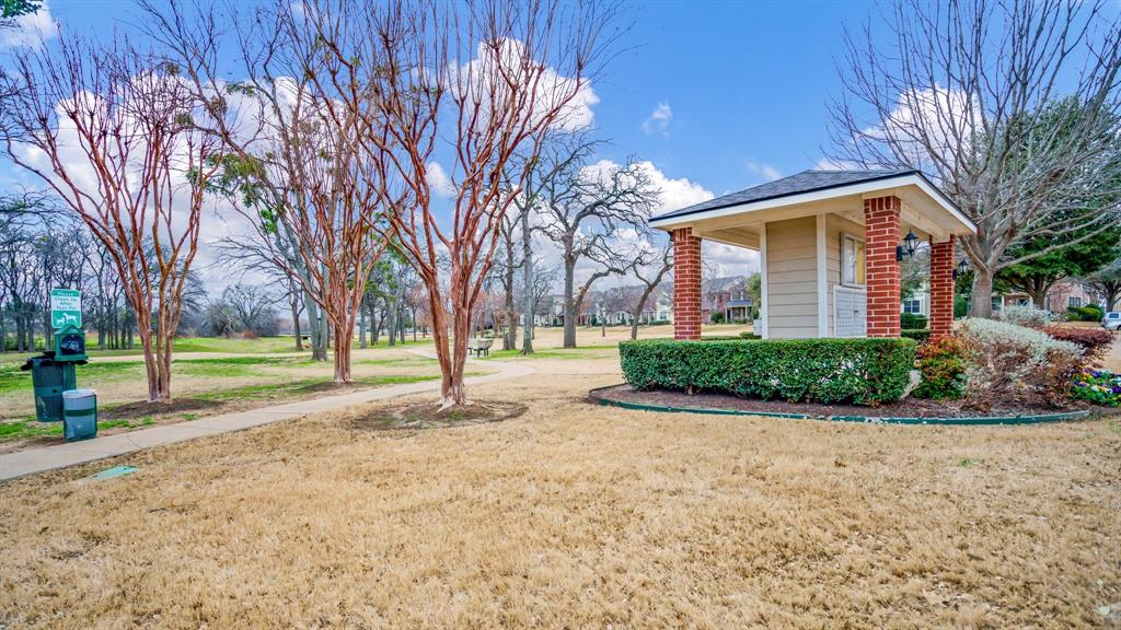 3206 Bedford Road Bedford, TX 76021 - Photo 24 of 26 a view of a house with a big yard and large trees