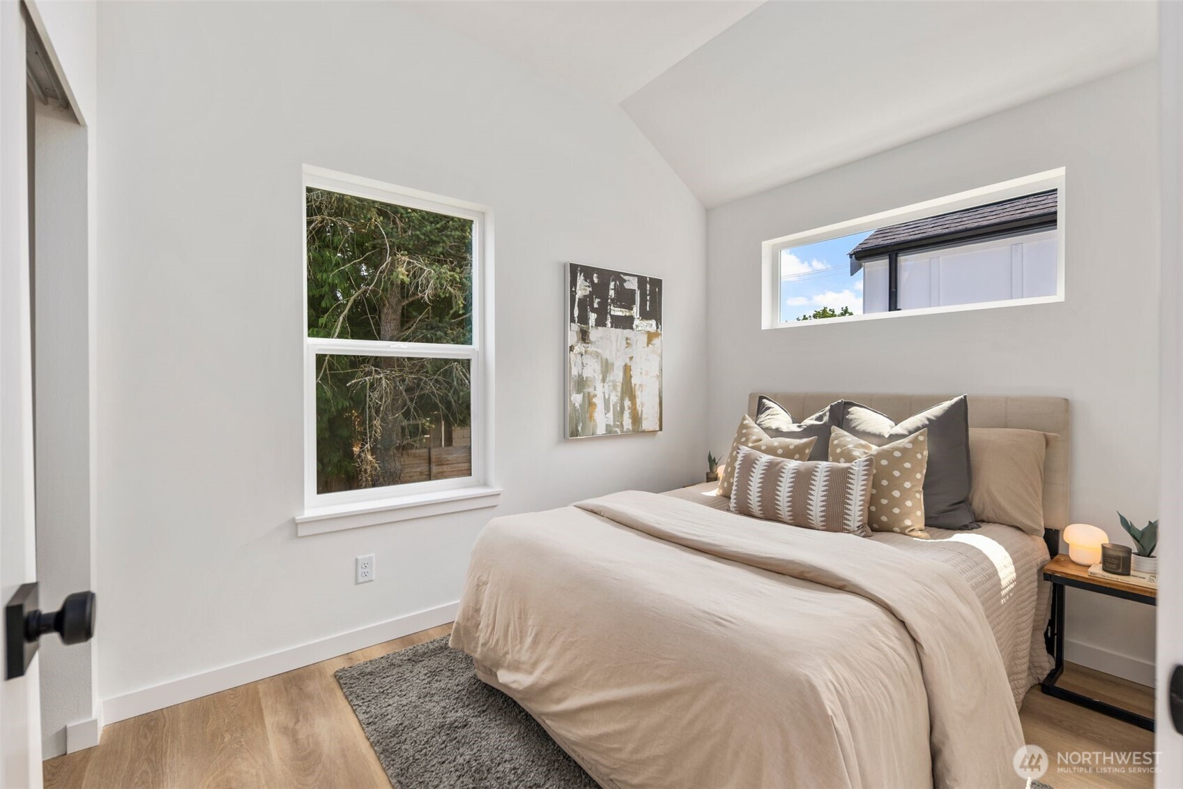 820 South Sullivan Street Seattle, WA 98108 - Photo 10 of 16 a bedroom with a bed and a window