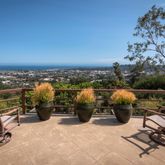 a view of a terrace with furniture and stove