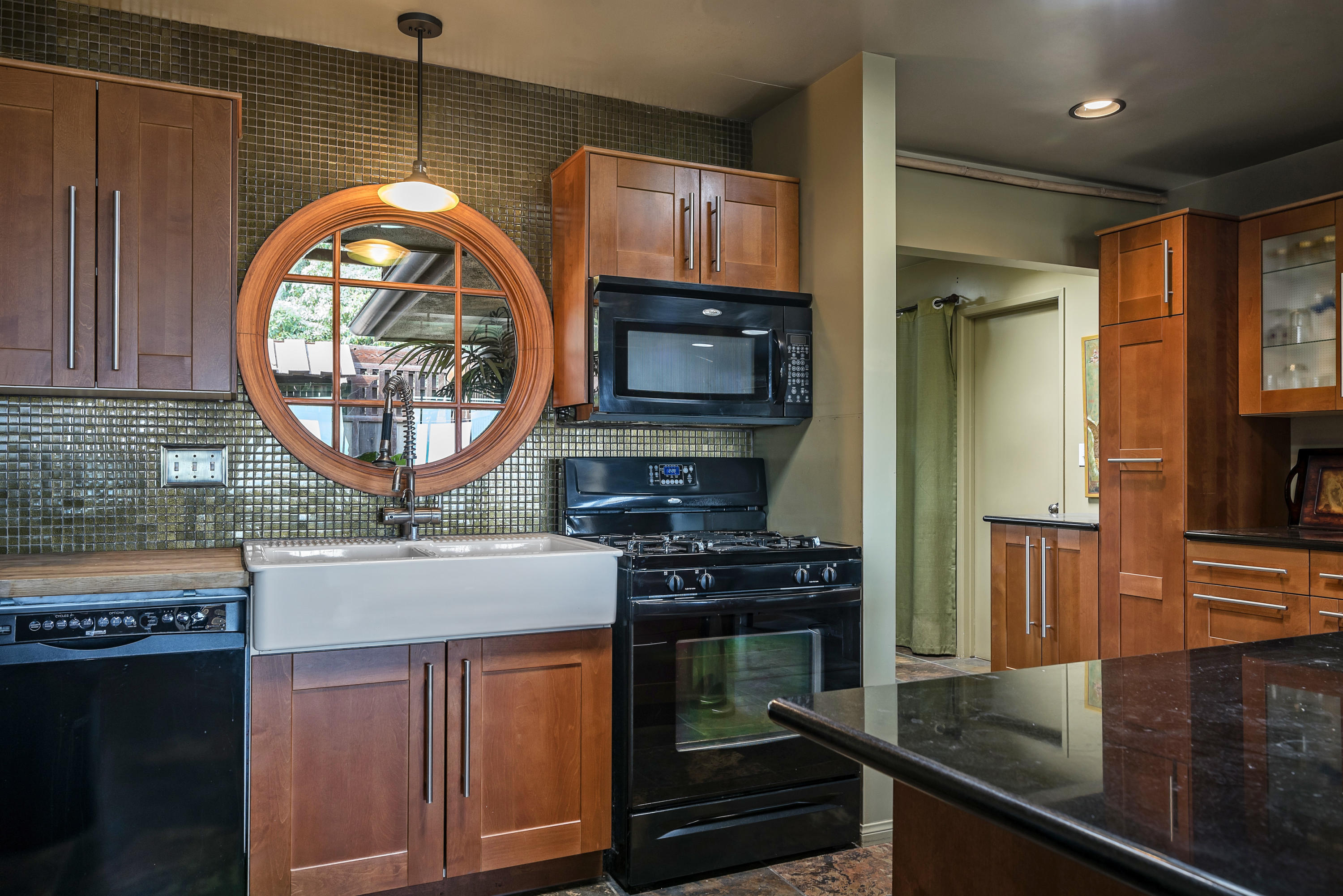982 Jimeno Road Santa Barbara, CA 93103 - Photo 4 of 6 a kitchen with stainless steel appliances granite countertop a stove and a microwave