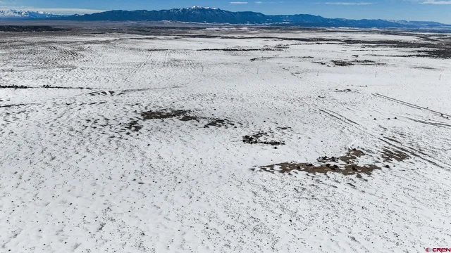 a view of beach and a field