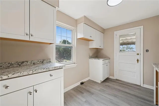 a kitchen with a sink and cabinets