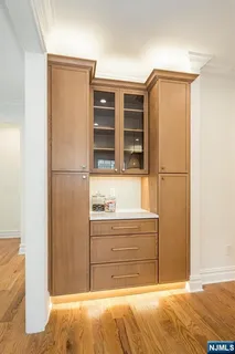 a kitchen with granite countertop a sink and a stove