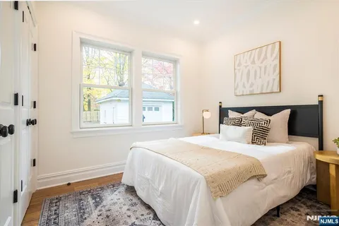 a bathroom with a toilet a sink and a mirror