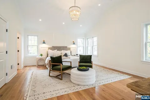 a view of a porch with furniture and garden