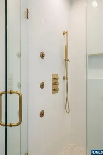 a spacious bedroom with a bed and a couch