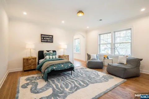 a living room with furniture and white floor