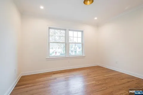 a kitchen with a sink cabinets and a window