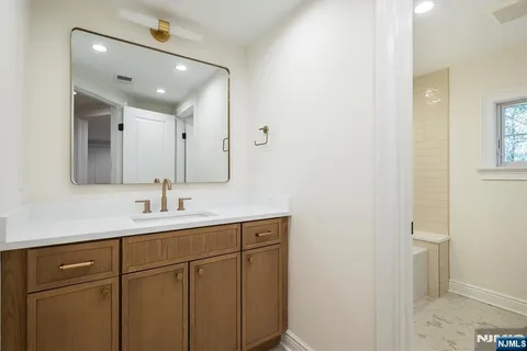a living room with furniture and a table with wooden floor