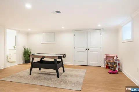 a bathroom with a granite countertop toilet sink and a mirror