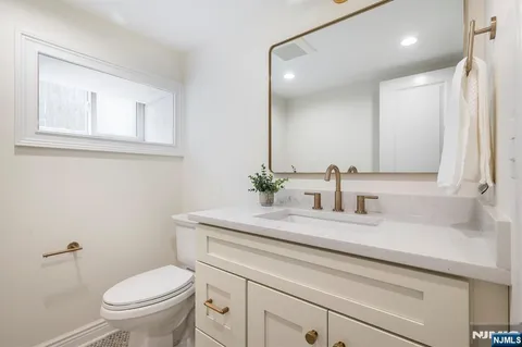 a view of a chair and table on the wooden floor