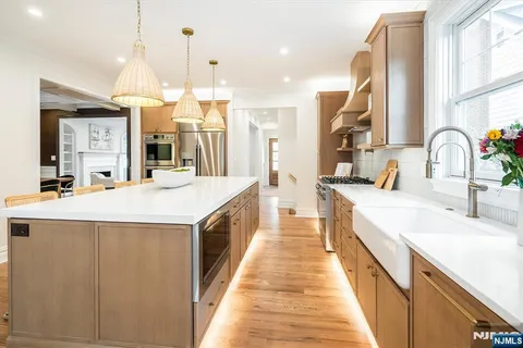 a dining table chairs and a kitchen view