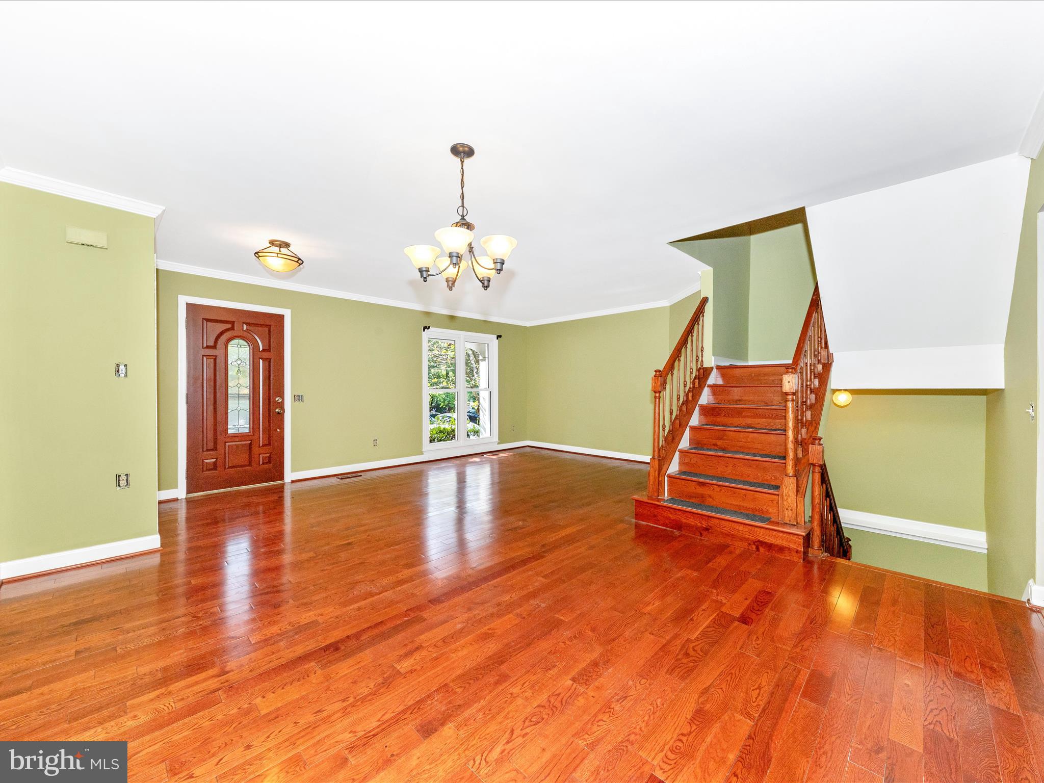 314 Crescendo Way Silver Spring, MD 20901 - Photo 11 of 57 a view of an room with wooden floor and staircase