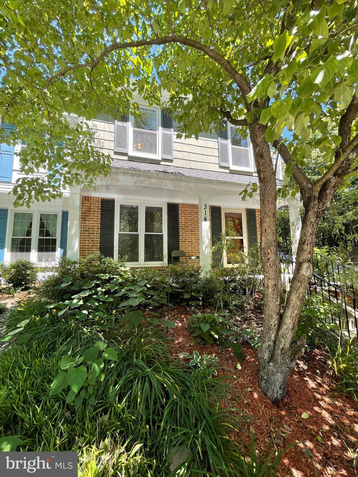 314 Crescendo Way Silver Spring, MD 20901 - Photo 2 of 57 a front view of a house with a garden