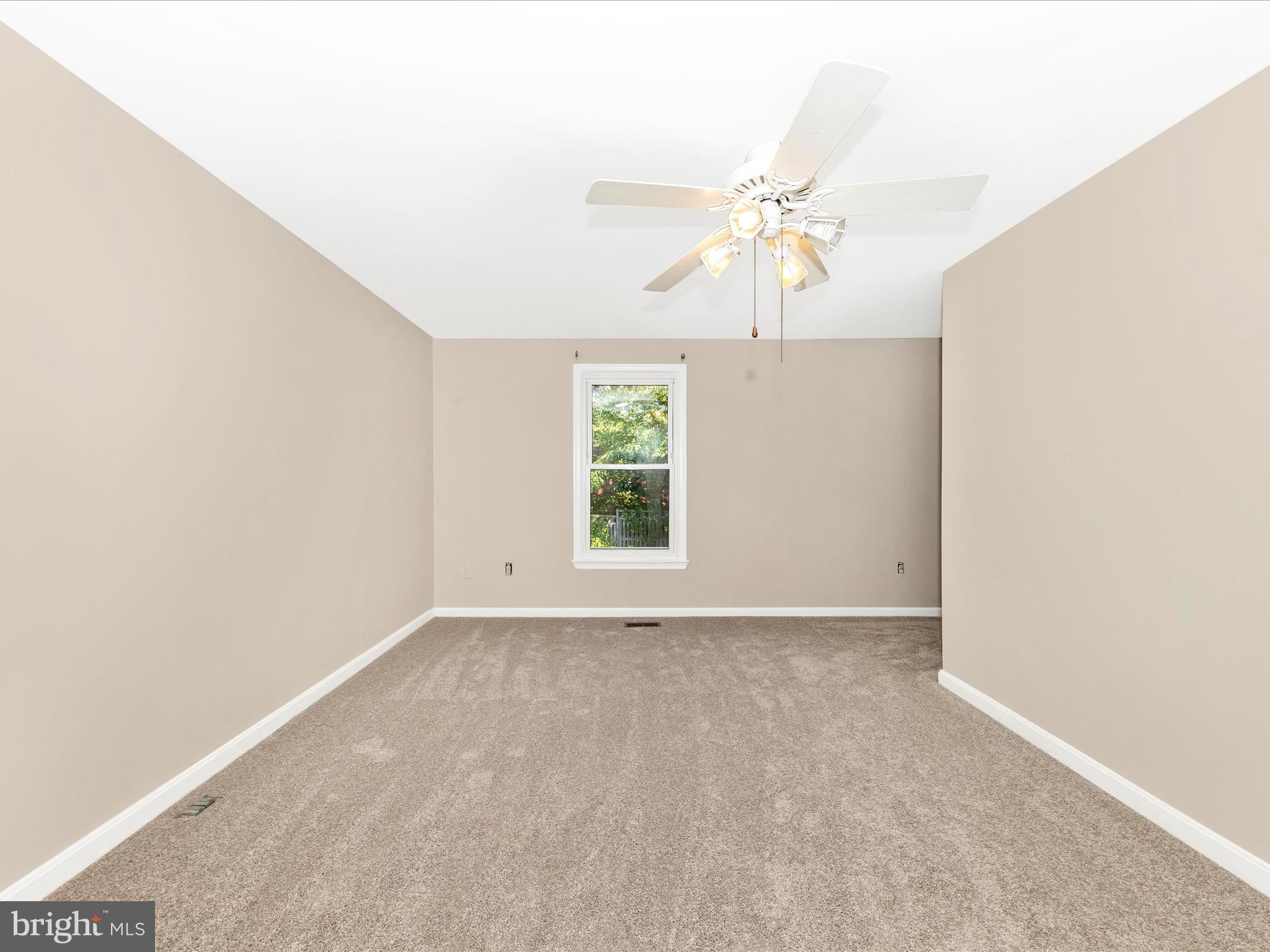 314 Crescendo Way Silver Spring, MD 20901 - Photo 22 of 57 an empty room with windows and fan