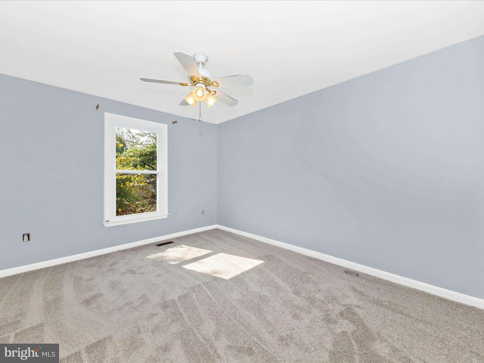 314 Crescendo Way Silver Spring, MD 20901 - Photo 28 of 57 an empty room with windows and fan