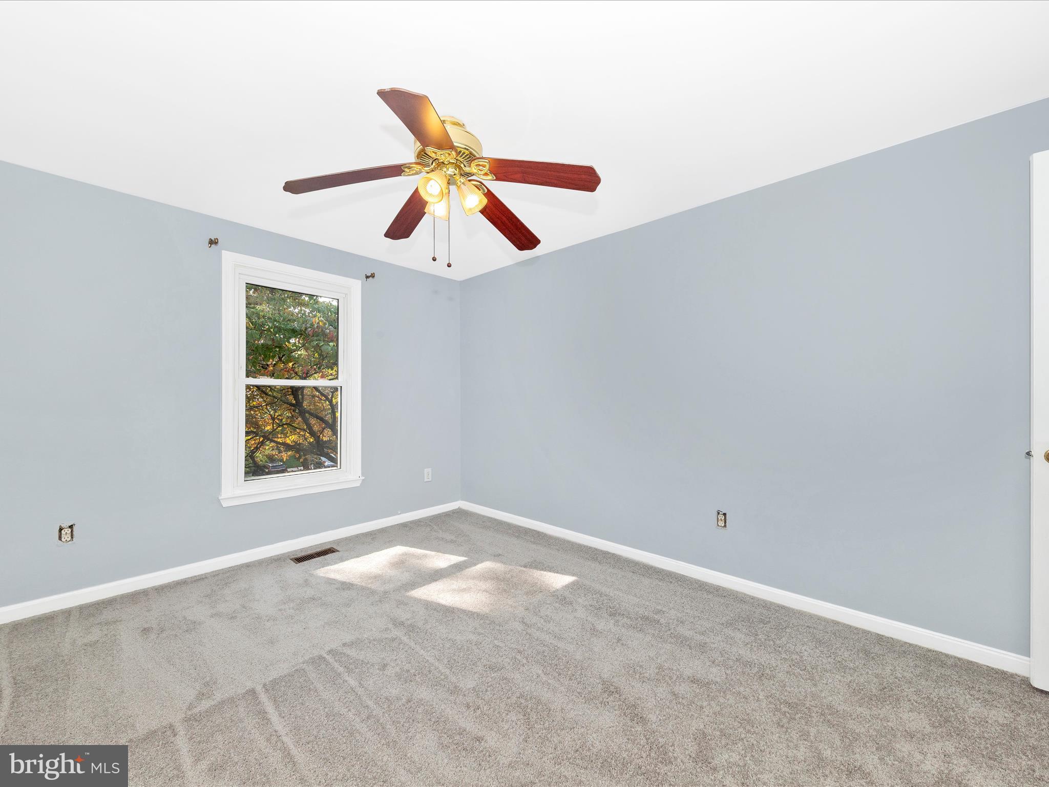 314 Crescendo Way Silver Spring, MD 20901 - Photo 31 of 57 an empty room with windows and fan
