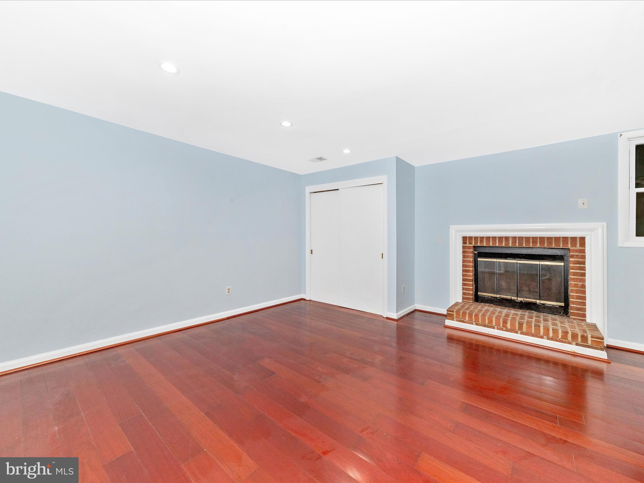 314 Crescendo Way Silver Spring, MD 20901 - Photo 33 of 57 an empty room with wooden floor fire place