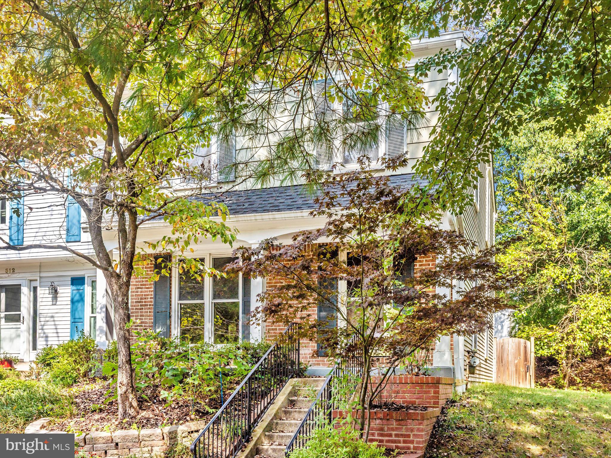 314 Crescendo Way Silver Spring, MD 20901 - Photo 41 of 57 front view of a brick house with a large tree