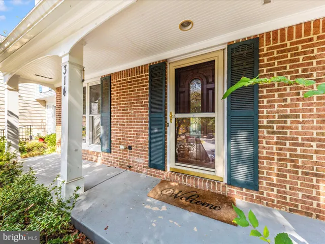 a view of a house with a wooden deck