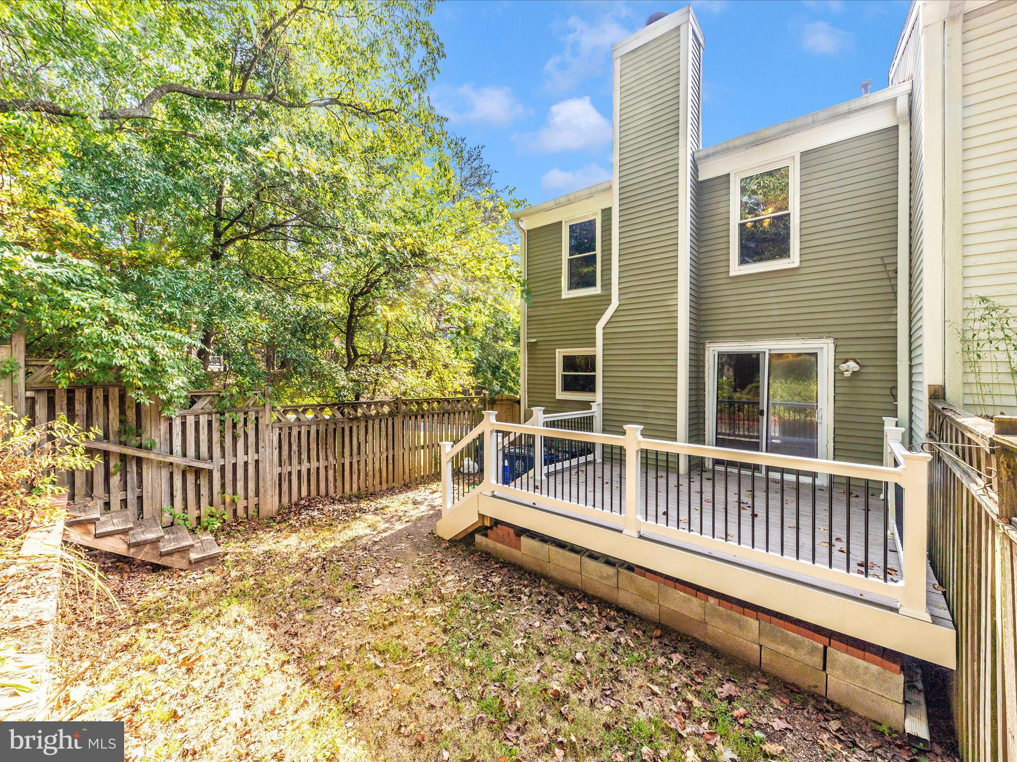 314 Crescendo Way Silver Spring, MD 20901 - Photo 47 of 57 a view of a house with a wooden deck