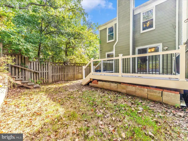 a view of backyard with a deck