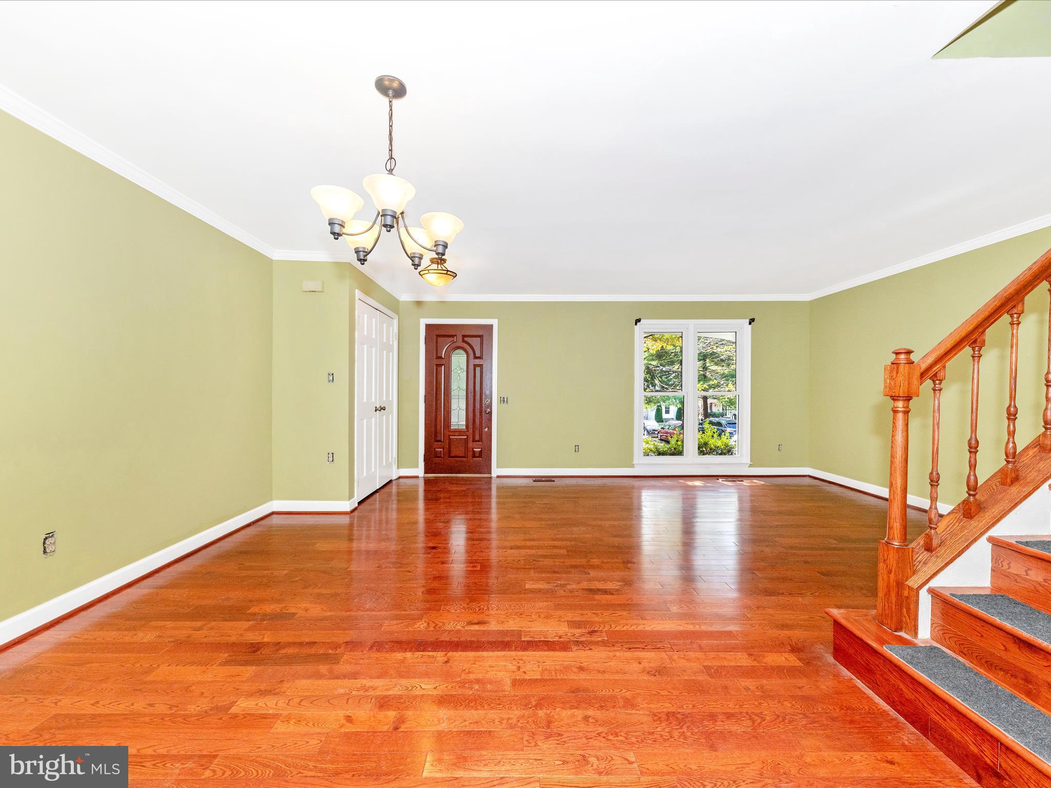 314 Crescendo Way Silver Spring, MD 20901 - Photo 9 of 57 a view of empty room with wooden floor and fan