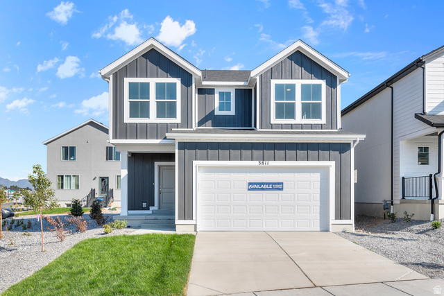 788 West 2840 South, Unit 2 Logan, UT 84321 - Photo 1 of 21 Modern two-story residence featuring dark vertical siding and white trim