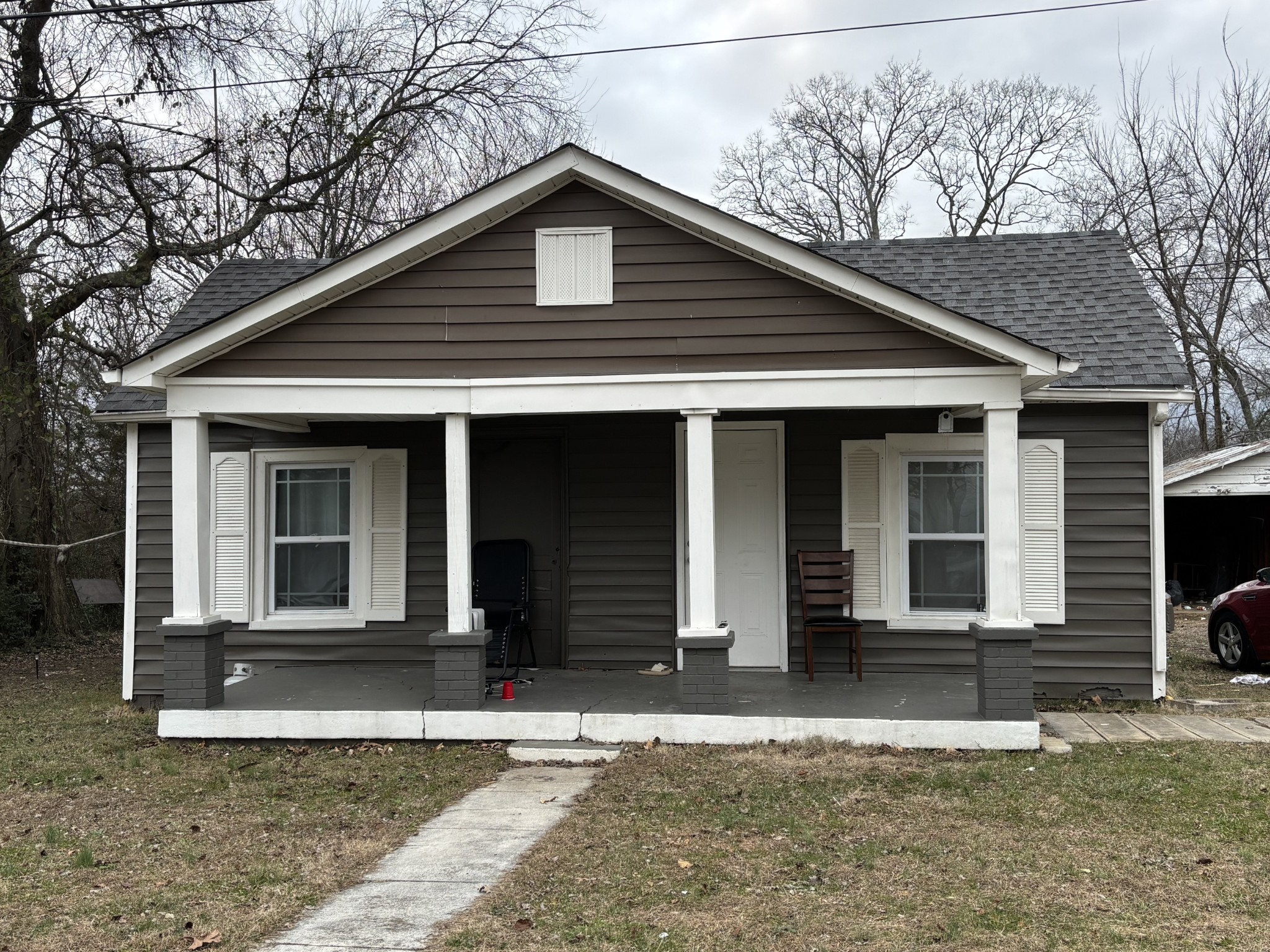 a front view of a house with a yard