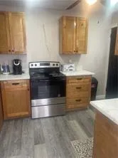 a kitchen with stainless steel appliances granite countertop a stove and a sink