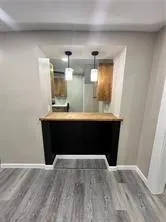 a room with a sink and a mirror