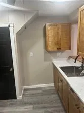a view of bathroom with a sink and mirror