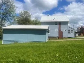 a view of outdoor space yard and front view of house