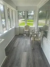 a view of empty room with outdoor view and a window