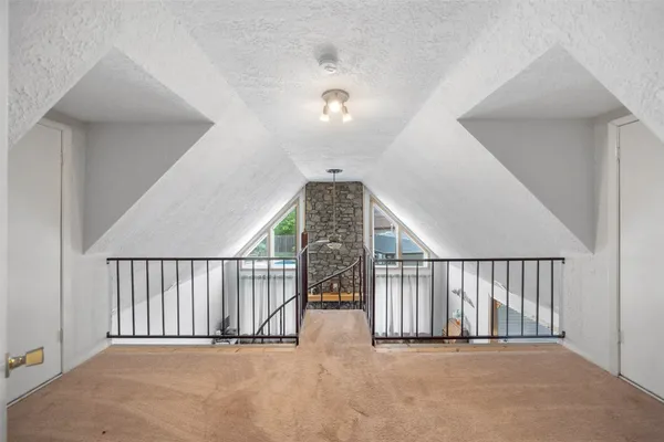 a view of a hallway with staircase