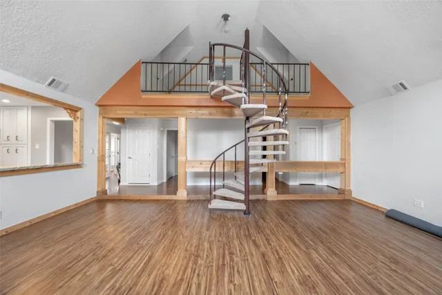 a view of entryway wooden floor and front door
