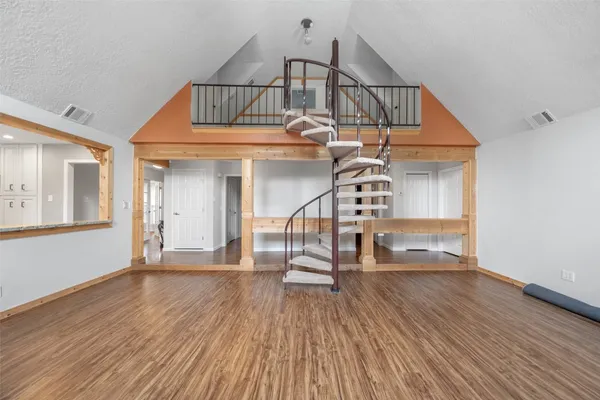 a view of entryway wooden floor and front door