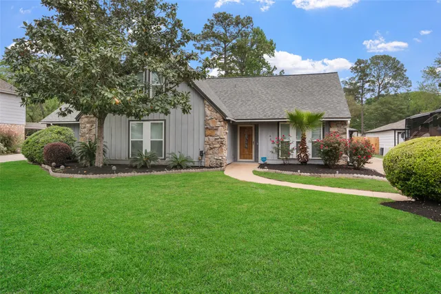 a front view of house with yard and outdoor seating