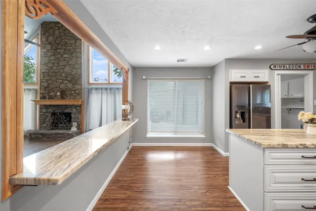 a view of a kitchen cabinets and a fireplace