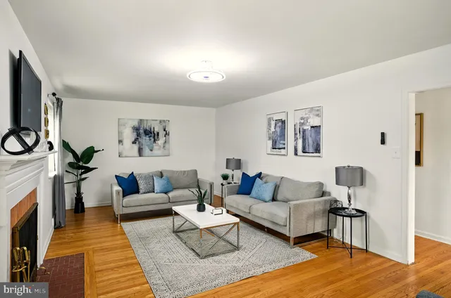 a living room with furniture and a rug