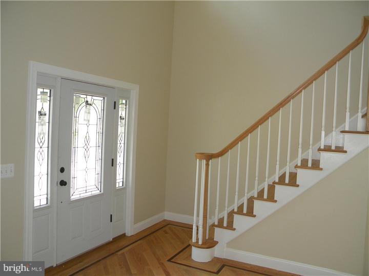 128 Cranbury Road Princeton Junction, NJ 08550 - Photo 2 of 25 a view of an entryway with wooden floor