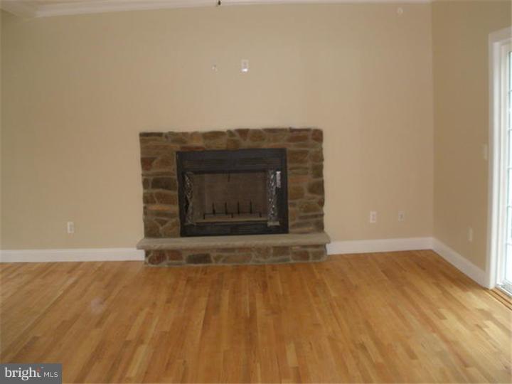 128 Cranbury Road Princeton Junction, NJ 08550 - Photo 16 of 25 a view of empty room with wooden floor