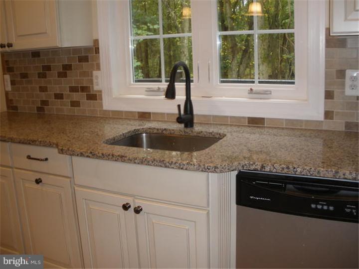 128 Cranbury Road Princeton Junction, NJ 08550 - Photo 5 of 25 a kitchen with a sink and a window