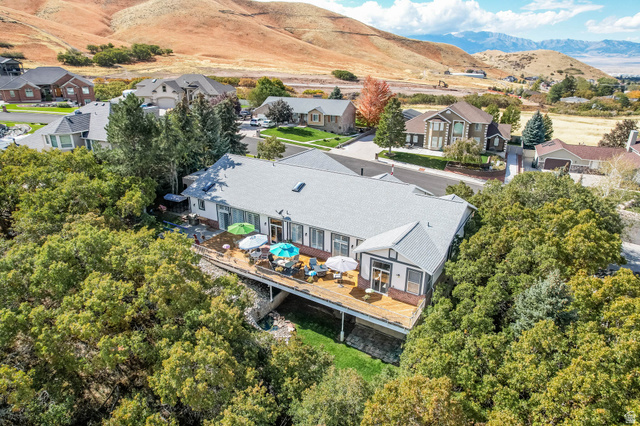 569 Elk Meadow Loop Tooele, UT 84074 - Photo 48 of 56 Aerial perspective of suburban area with a mountain backdrop