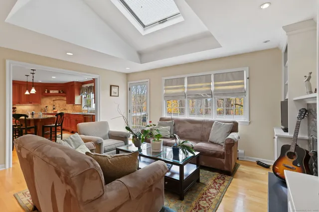 a living room with furniture window and a flat screen tv