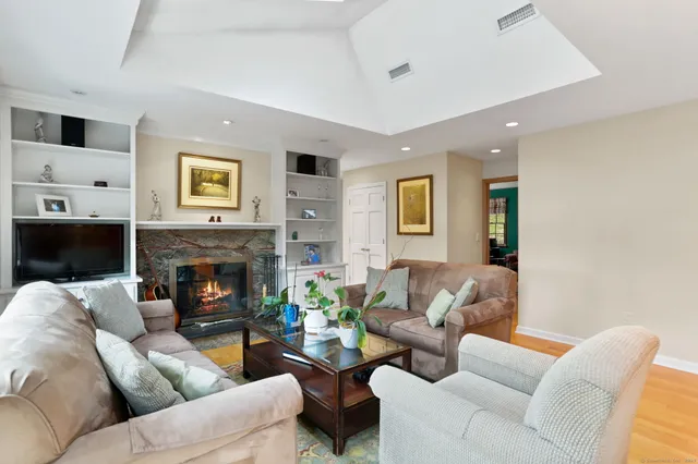 a living room with furniture and a fireplace