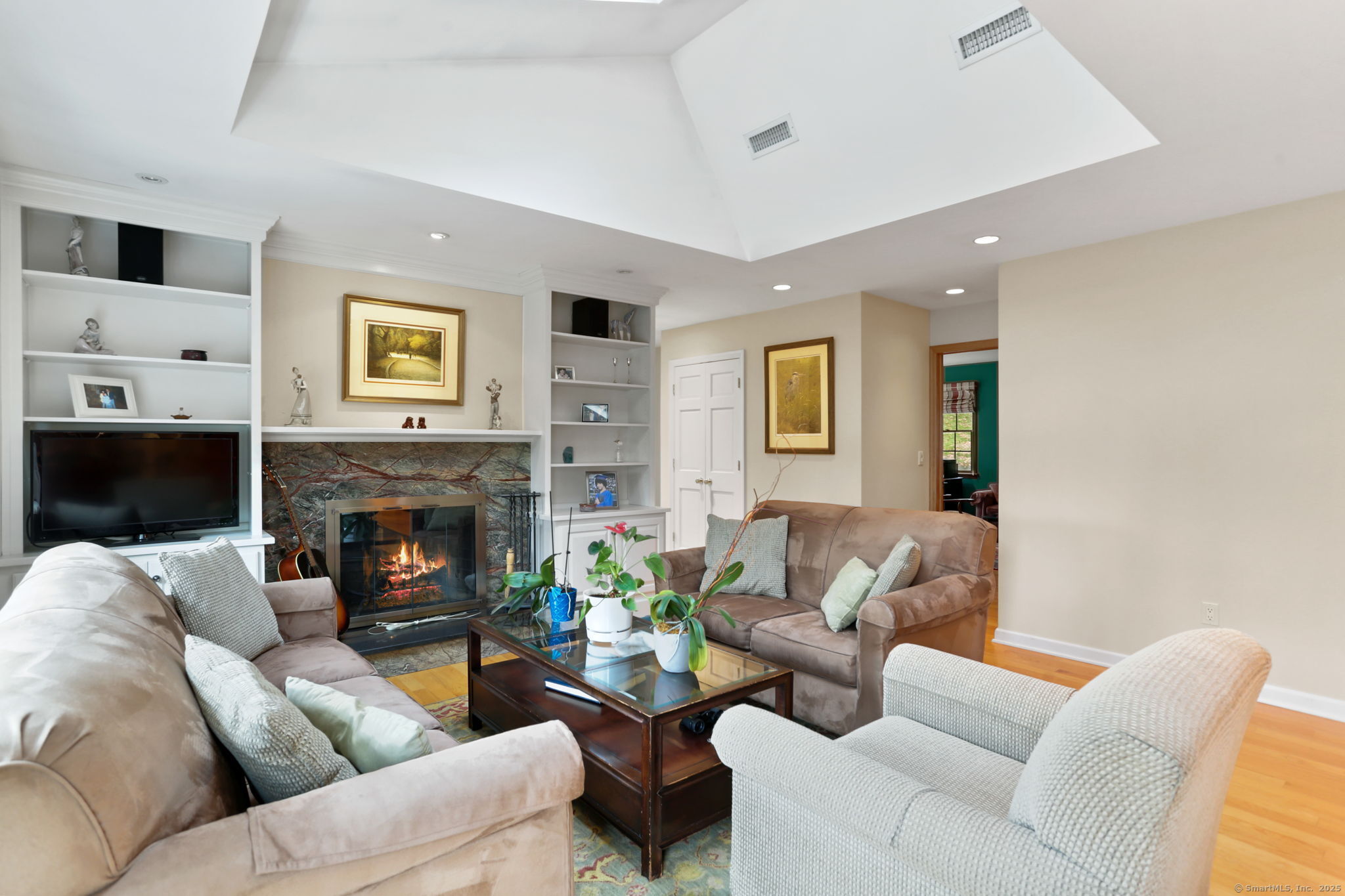 41 Calvin Road Wilton, CT 06897 - Photo 16 of 34 a living room with furniture and a fireplace